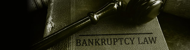 bankruptcy law book with gavel on top